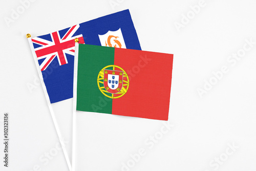 Portugal and Anguilla stick flags on white background. High quality fabric, miniature national flag. Peaceful global concept.White floor for copy space. Free Download Portugal and Anguilla stick flags on white background. High quality fabric, miniature national flag. Peaceful global concept.White floor for copy space. - GFXLoad