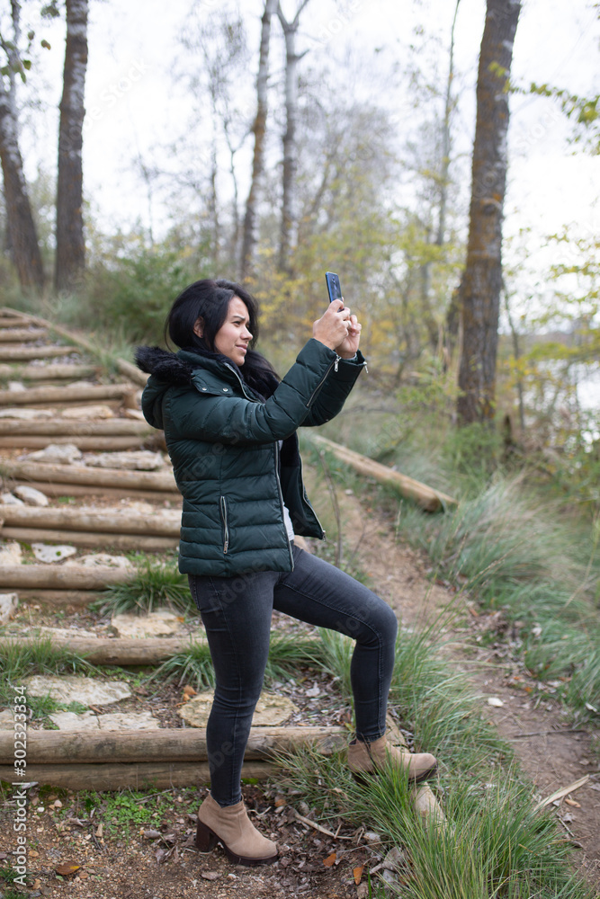 Fototapeta premium happy young woman taking selfie