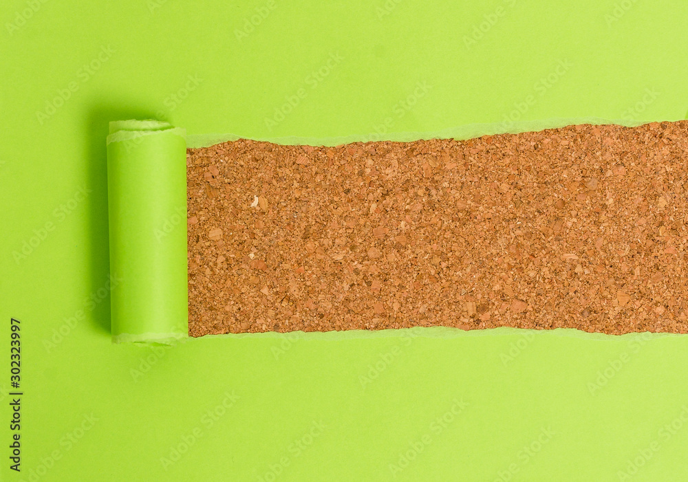 Obraz premium Cardboard which is torn in the middle placed above a wooden classic table