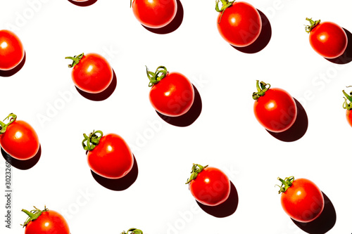 Cherry tomatoes over white background