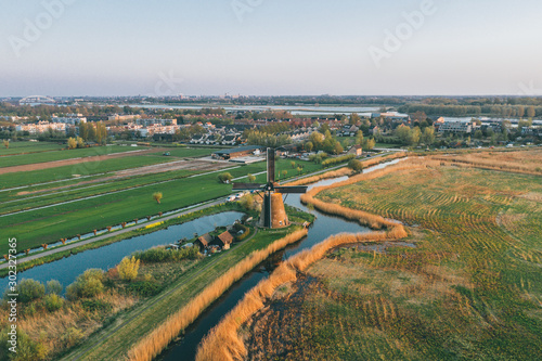 Aerial drone shot view of Kinderdijk Wind Mills in the filed near Rotterdam in Netherlands