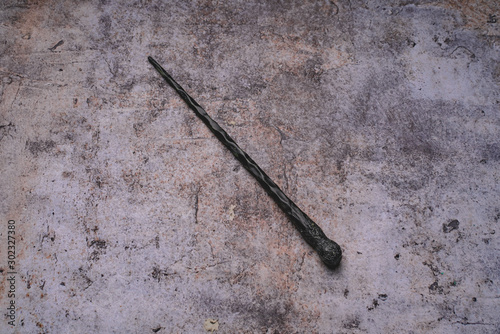 Foto magic wand on gray background. Copy space for text