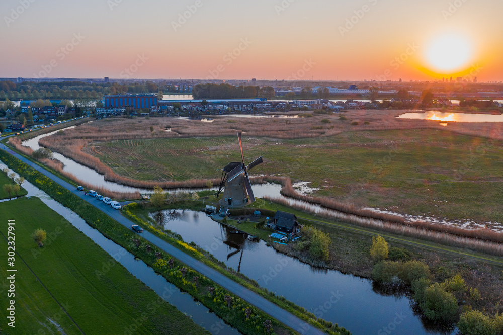 Aerial drone shot view of Kinderdijk Wind Mills in the filed near Rotterdam  in Netherlands Stock Photo | Adobe Stock