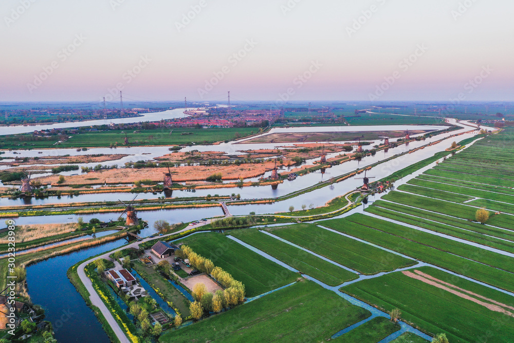 Aerial drone shot view of Kinderdijk Wind Mills in the filed near Rotterdam  in Netherlands Stock Photo | Adobe Stock