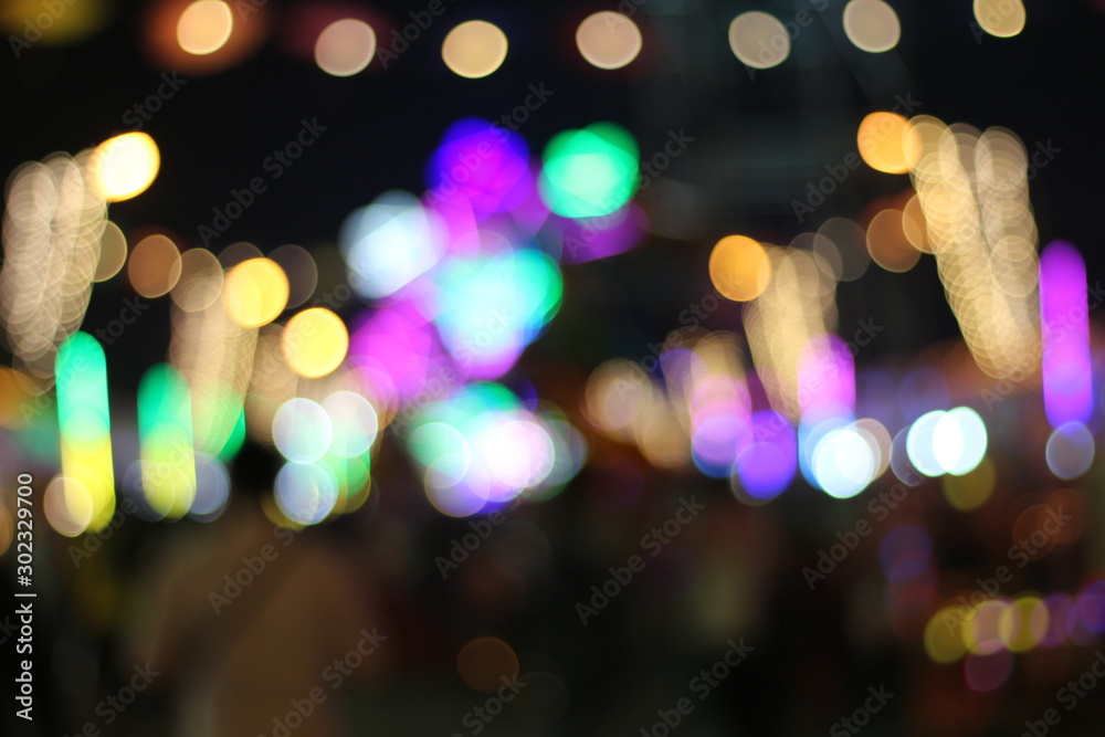 blur colors of fluorescent light colorful in dark for festival temple fair  background. Stock Photo | Adobe Stock