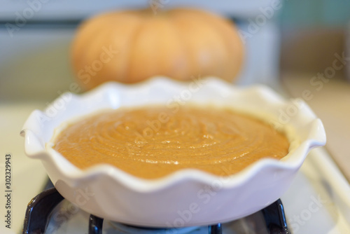 фотографія Making homemade pumpkin pie for the holidays