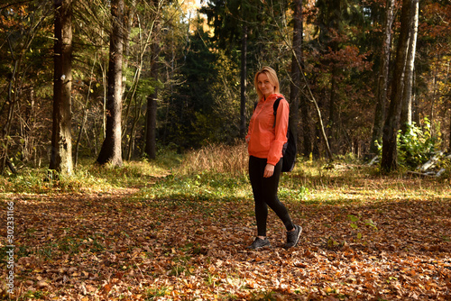 portrait of a blonde against the forest