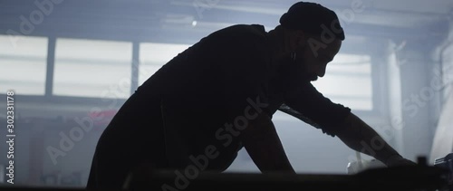 Series of photographs / portrait of a designer / artist, building furniture, photography in nature and industry, developing photos in a darkroom, crafts such as, drilling, grinding, sawing and Tattoo