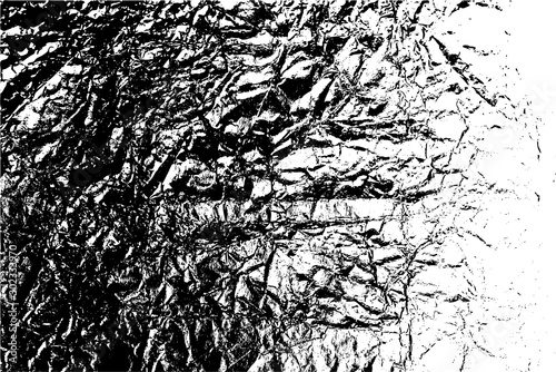 Distressed overlay texture of rough surface, crumpled foil, cracks and creases. Grunge background. One color graphic resource.