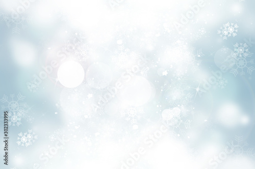 white and gray Christmas light with snowflake bokeh background, Winter backdrop wallpaper. © ooddysmile