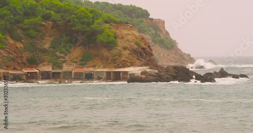 Boathouses at Cala Llenya, Ibiza, Spain photo