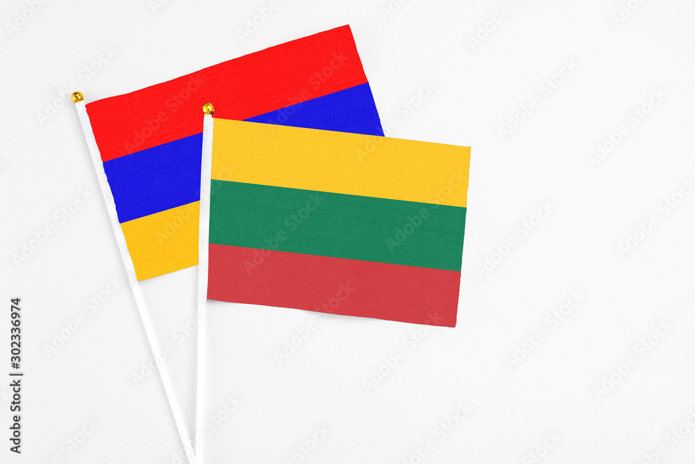 Lithuania and Armenia stick flags on white background. High quality fabric, miniature national flag. Peaceful global concept.White floor for copy space. Lithuania and Armenia stick flags on white background. High quality fabric, miniature national flag. Peaceful global concept.White floor for copy space.