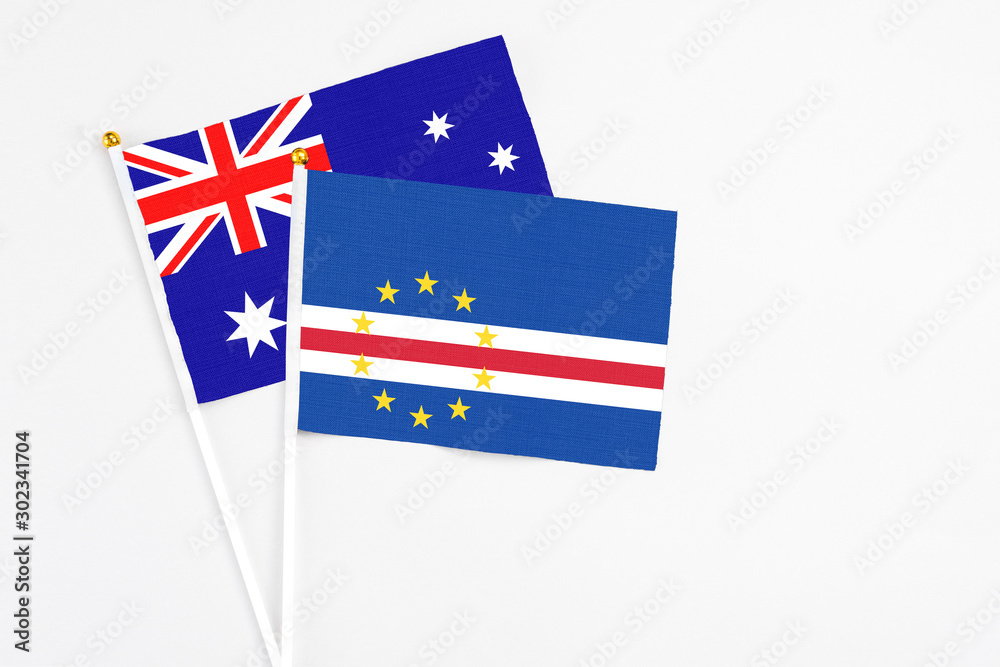 Cape Verde and Australia stick flags on white background. High quality fabric, miniature national flag. Peaceful global concept.White floor for copy space. Cape Verde and Australia stick flags on white background. High quality fabric, miniature national flag. Peaceful global concept.White floor for copy space.