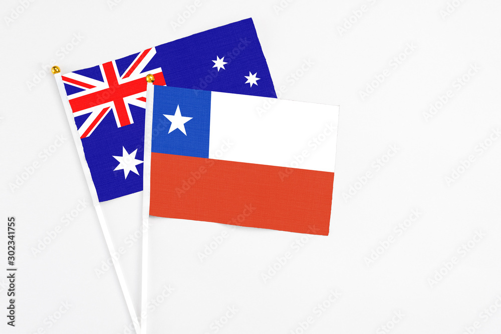 Chile and Australia stick flags on white background. High quality fabric, miniature national flag. Peaceful global concept.White floor for copy space.
