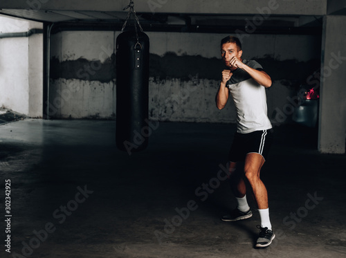 Fighter boxer training box in garage © qunica.com