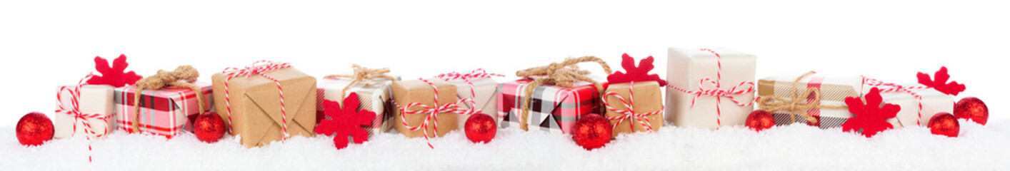 Christmas border of rustic red, white, brown and plaid gift boxes in snow. Side view isolated on a white background.