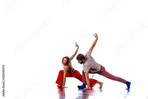 Two young breakdancers dancing together
