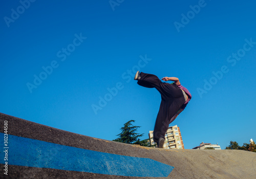 Athletic person doing a side flip