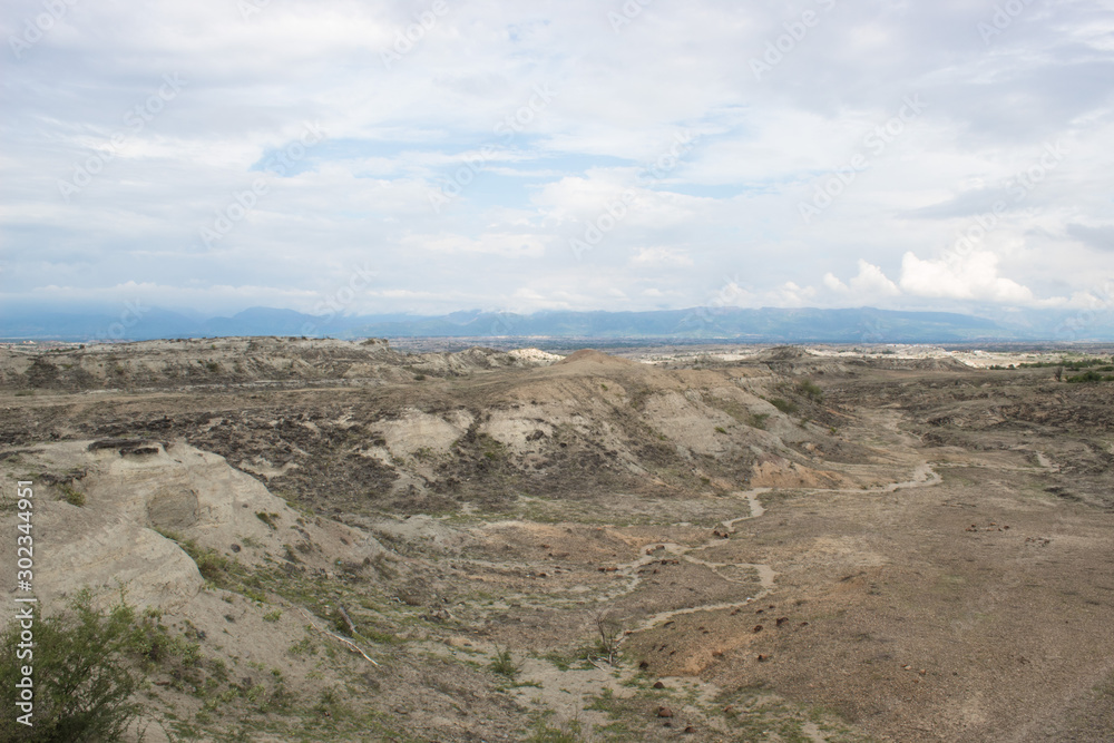 Los Hoyos Canyon and trekking routes with clouds and blue sky