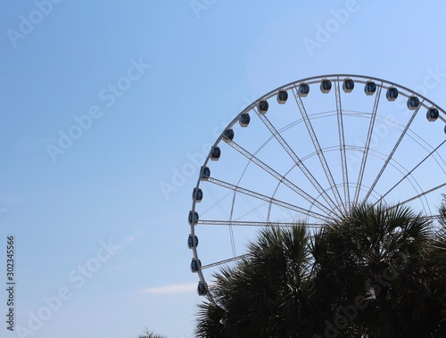 Ferris wheel against blue sky