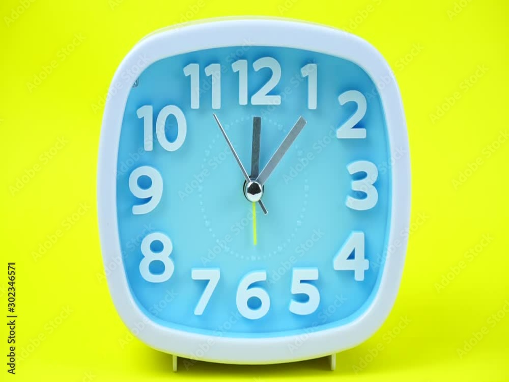 Blue Alarm clock on Yellows background. Blue Alarm clock on Yellows background.