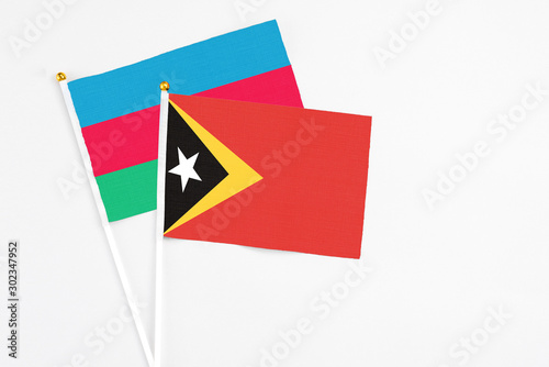 East Timor and Azerbaijan stick flags on white background. High quality fabric, miniature national flag. Peaceful global concept.White floor for copy space. Free Download East Timor and Azerbaijan stick flags on white background. High quality fabric, miniature national flag. Peaceful global concept.White floor for copy space. - GFXLoad