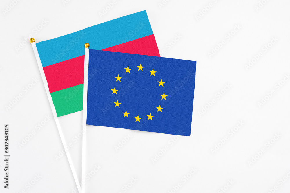 European Union and Azerbaijan stick flags on white background. High quality fabric, miniature national flag. Peaceful global concept.White floor for copy space. European Union and Azerbaijan stick flags on white background. High quality fabric, miniature national flag. Peaceful global concept.White floor for copy space.