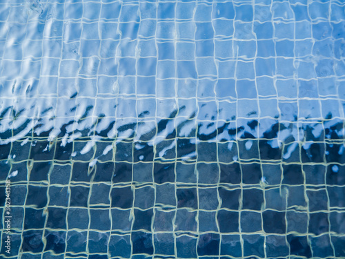 Pool texture with water ripple split in light and dark tone © YUU-ME