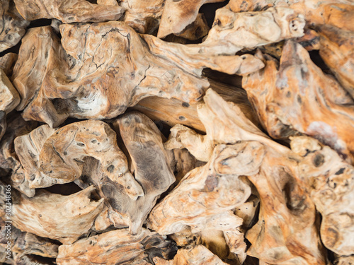 Pieces of wood in bone shapes, selective focus