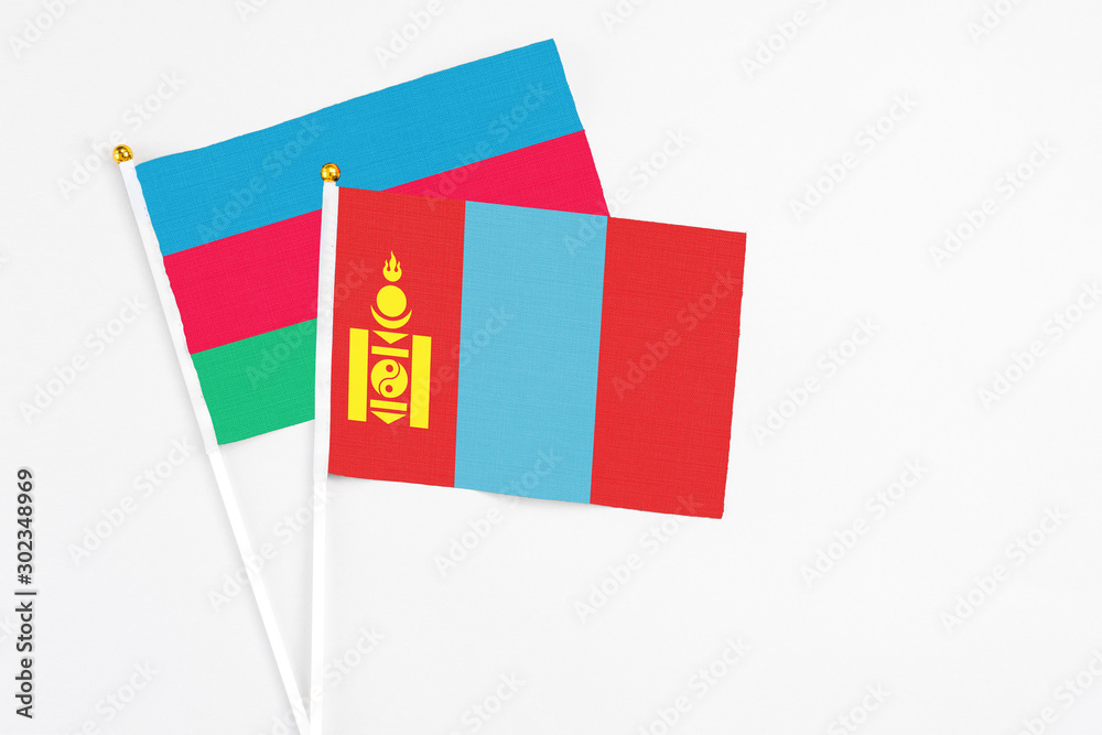 Naklejka premium Mongolia and Azerbaijan stick flags on white background. High quality fabric, miniature national flag. Peaceful global concept.White floor for copy space.