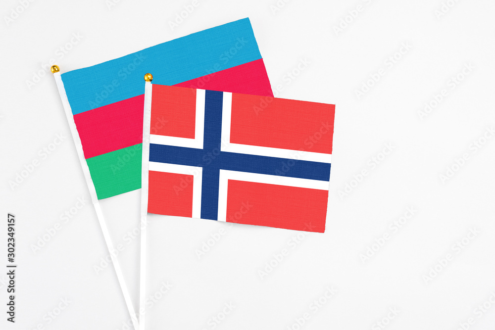Norway and Azerbaijan stick flags on white background. High quality fabric, miniature national flag. Peaceful global concept.White floor for copy space.