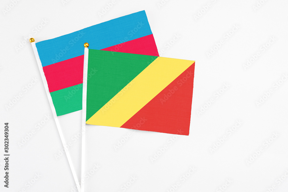 Republic Of The Congo and Azerbaijan stick flags on white background. High quality fabric, miniature national flag. Peaceful global concept.White floor for copy space. Republic Of The Congo and Azerbaijan stick flags on white background. High quality fabric, miniature national flag. Peaceful global concept.White floor for copy space.