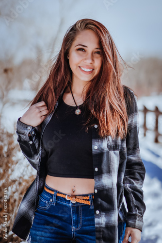 Beautiful young lady posing in a cold weather