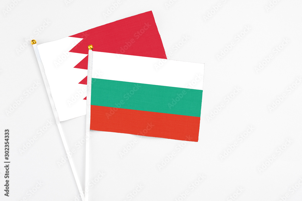 Bulgaria and Bahrain stick flags on white background. High quality fabric, miniature national flag. Peaceful global concept.White floor for copy space. Bulgaria and Bahrain stick flags on white background. High quality fabric, miniature national flag. Peaceful global concept.White floor for copy space.