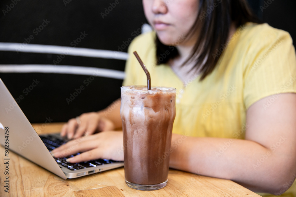 GIRL WORKING AND DRINK COCOA GIRL WORKING AND DRINK COCOA