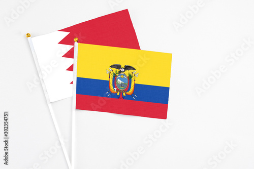 Ecuador and Bahrain stick flags on white background. High quality fabric, miniature national flag. Peaceful global concept.White floor for copy space. Free Download Ecuador and Bahrain stick flags on white background. High quality fabric, miniature national flag. Peaceful global concept.White floor for copy space. - GFXLoad