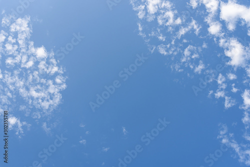 Blue sky and clean white clouds as a nature background photo