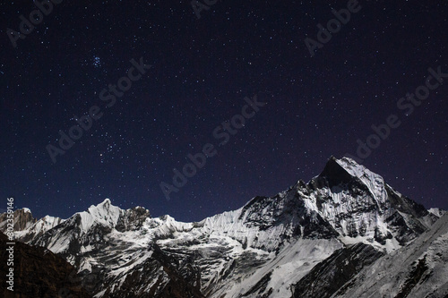 Machapuchare below a night sky in the Annapurna Sanctuary, Nepal. 