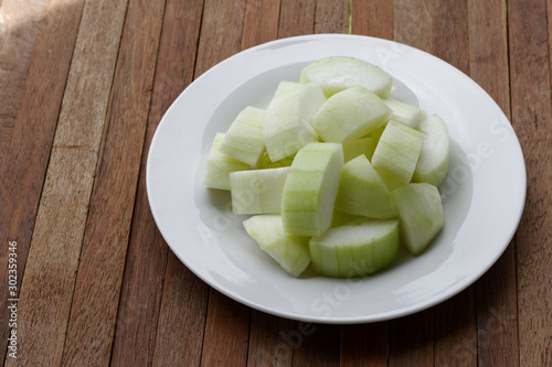 Sliced winter melon on white plate