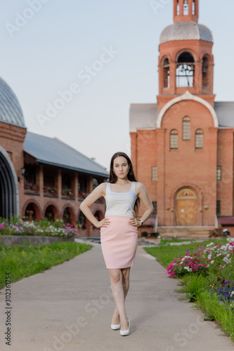young woman in front of the church