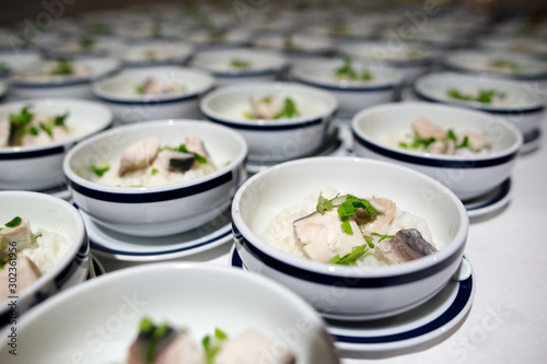 Row of Bowl boiled rice with fish fillet