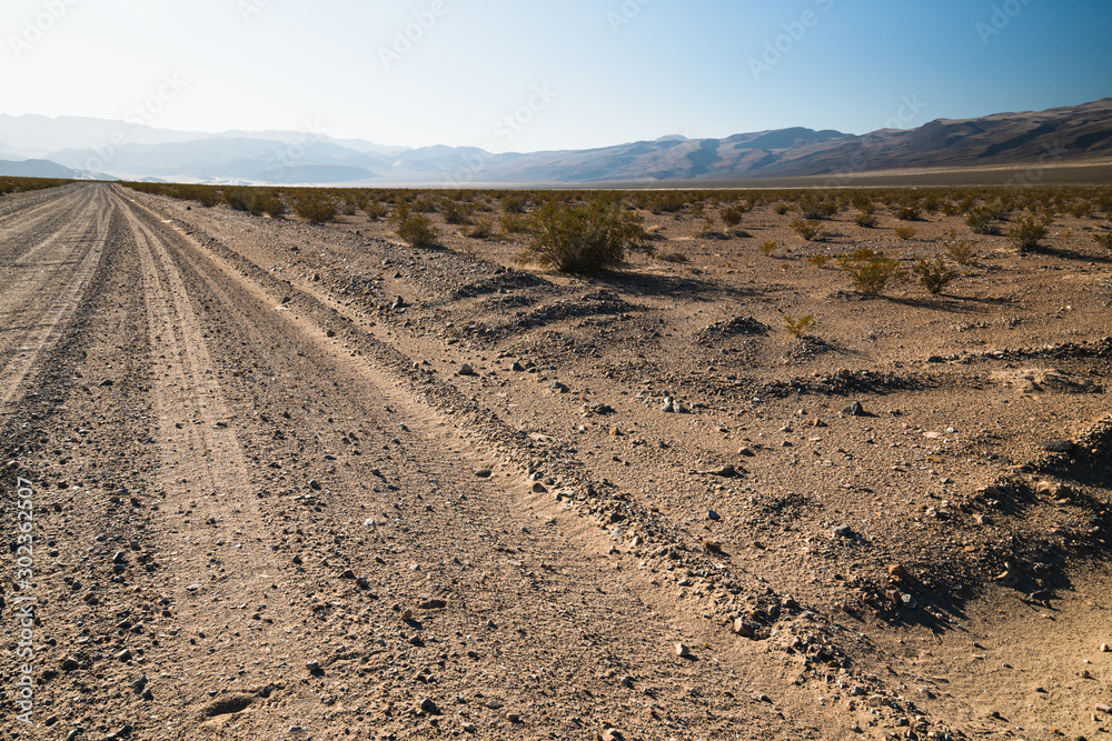 Unpaved road in desert. Death Valley National Park Unpaved road in desert. Death Valley National Park