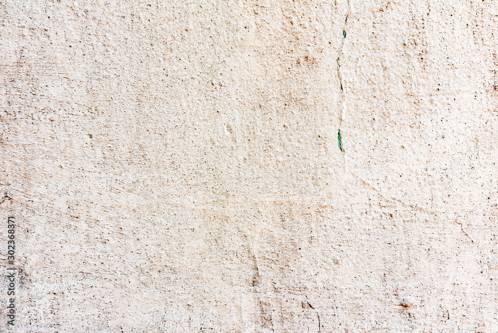 Texture of a concrete wall with cracks and scratches which can be used as a background Texture of a concrete wall with cracks and scratches which can be used as a background