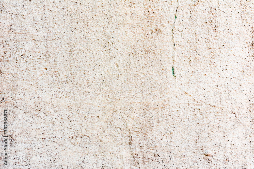 Texture of a concrete wall with cracks and scratches which can be used as a background