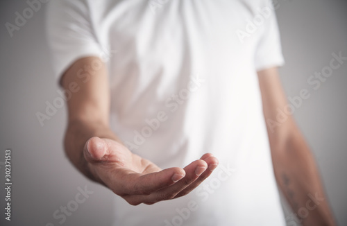Man showing empty hand. Giving gesture