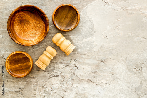 Making wooden dishes. Empty bowls on grey background top view copy space