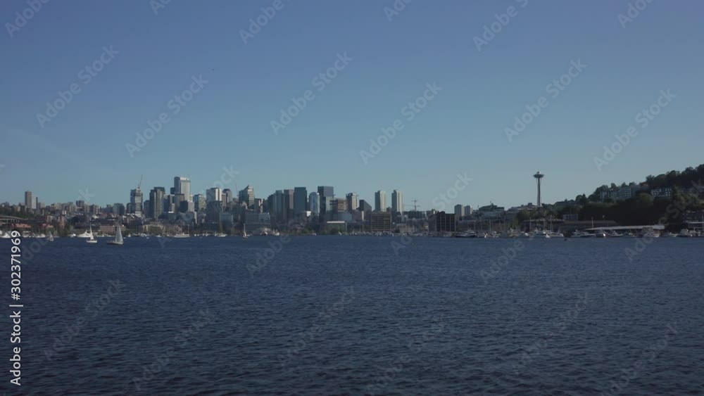 Flying Over South Lake Union Toward Seattle Downtown on Sunny Day. Boats and Waterfront of Famous American City Flying Over South Lake Union Toward Seattle Downtown on Sunny Day. Boats and Waterfront of Famous American City