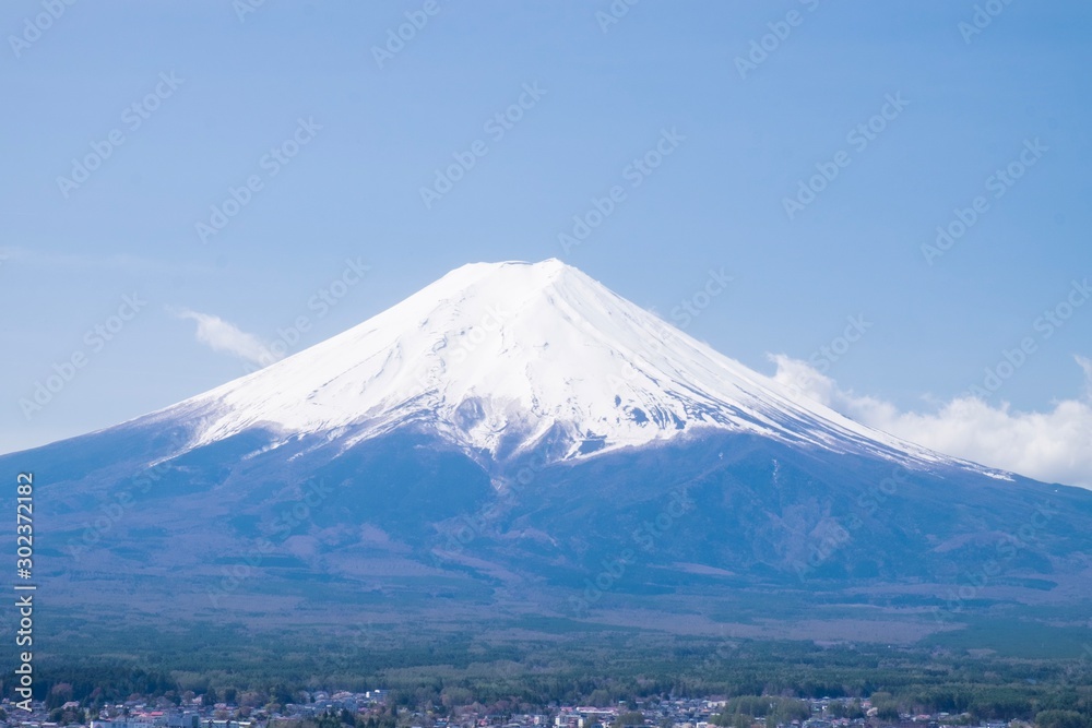 Mt. fuji with snow cap under blue sky in japan