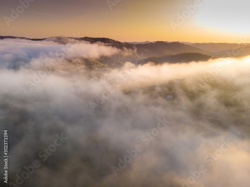 Aerial View landscape view white clouds in mountain and colorful sky at morning. Top clouds view from drone. © dvv1989