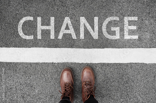 Change business and changing ahead concept background. Selfie of feet and legs in leather ankle boots shoes on pathway. Moving forward or new beginning your life idea. Top view hipster on start line.